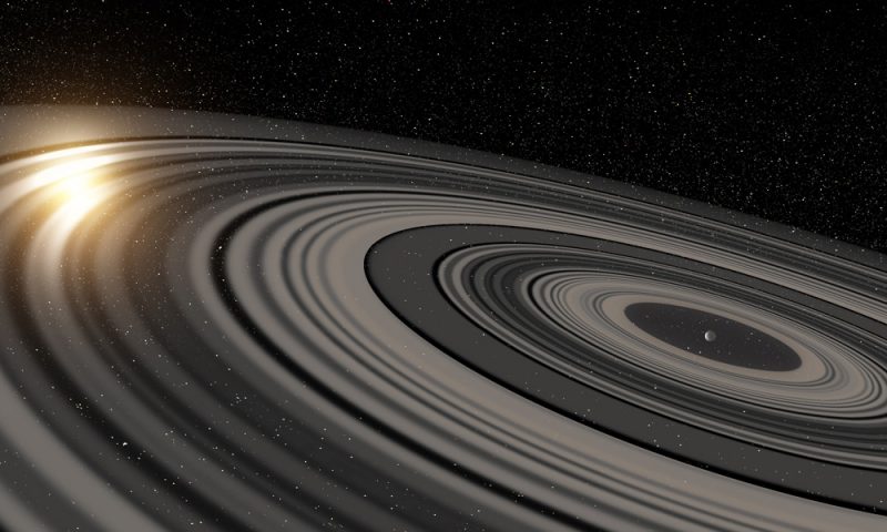 Planeta J1407b z ogromnym systemem pierścieni. Rys. Ron Miller