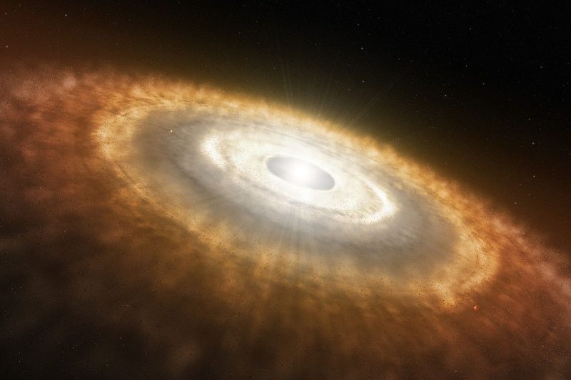 Młoda gwiazda otoczona dyskiem protoplanetarnym. Rys. ESO/L Calçada
